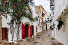 Charming empty cobblestone white-washed street of old town of Ibiza (Eivissa), Balearic Islands. Spain