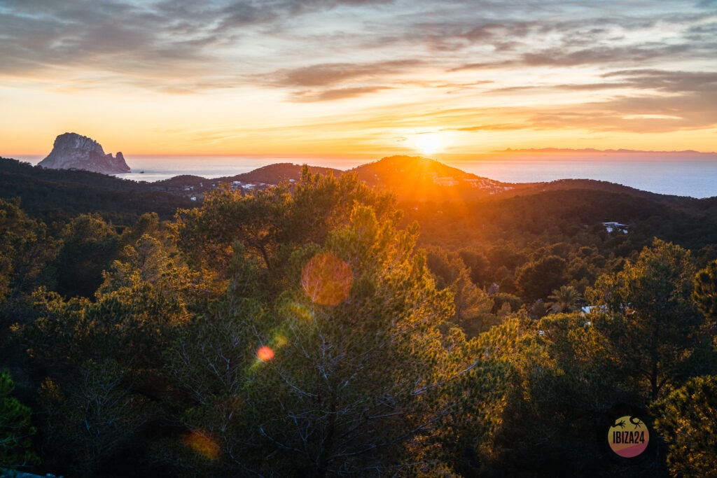 Sunset view from Sa Talaia mountain in Ibiza with golden skies