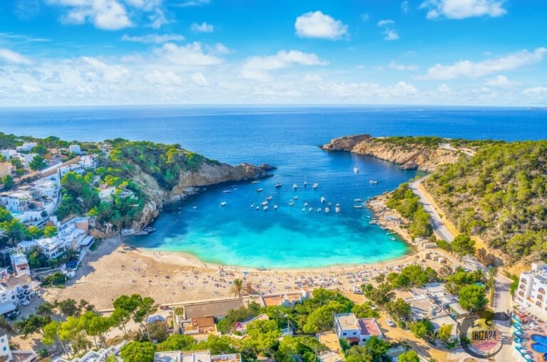 Tranquil Cala Vadella Bay in Ibiza with turquoise waters and white sandy beaches