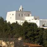 Church of Sant Miquel de Balansat on a hilltop surrounded by trees in Ibiza