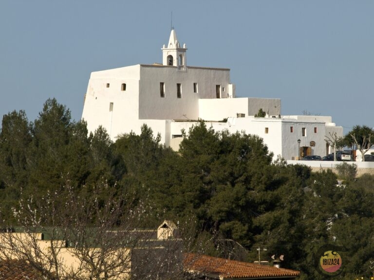 Church of Sant Miquel de Balansat on a hilltop surrounded by trees in Ibiza