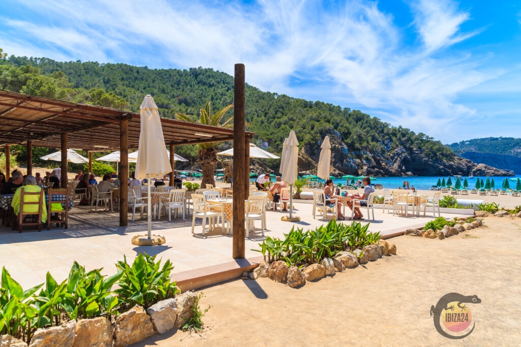 Roca y Mar restaurant terrace with the beach of Benirrás in the background, Ibiza.
