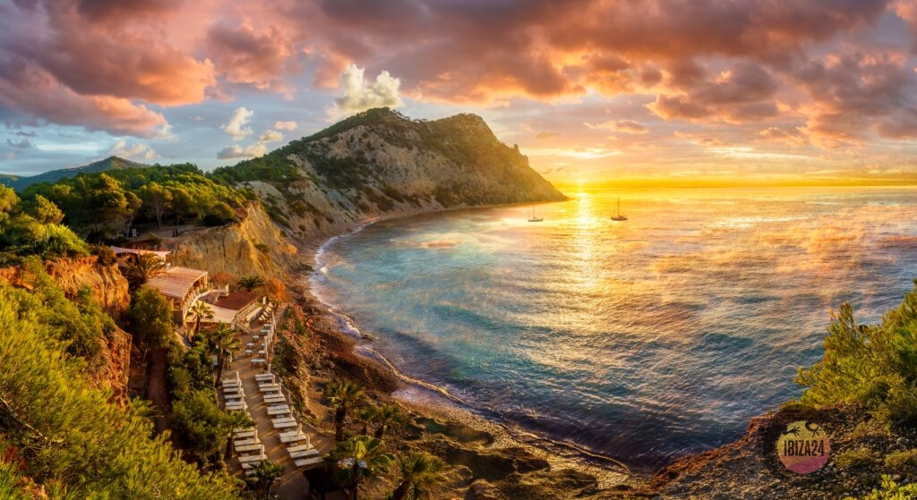 Sunset at Sol d'en Serra with Beachclub Amante, Ibiza, golden sky over the sea