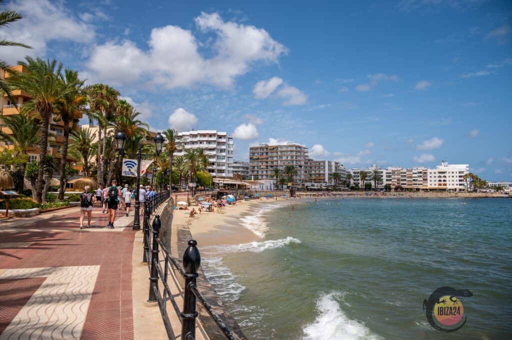 Sandy beach in Santa Eulària, Ibiza, with calm turquoise waters, perfect for families and relaxation