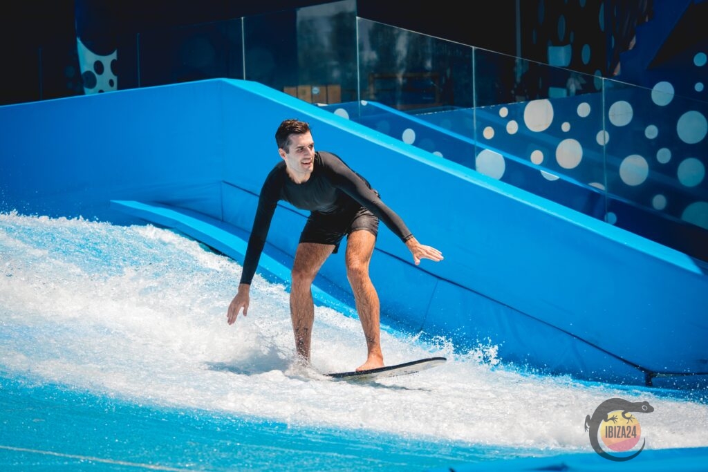 Guest enjoying Flow Surf wave simulator at Bambuku Surf Lounge Ibiza