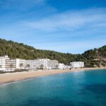 Quiet Ibiza Cala San Vicente beach with empty sands in February